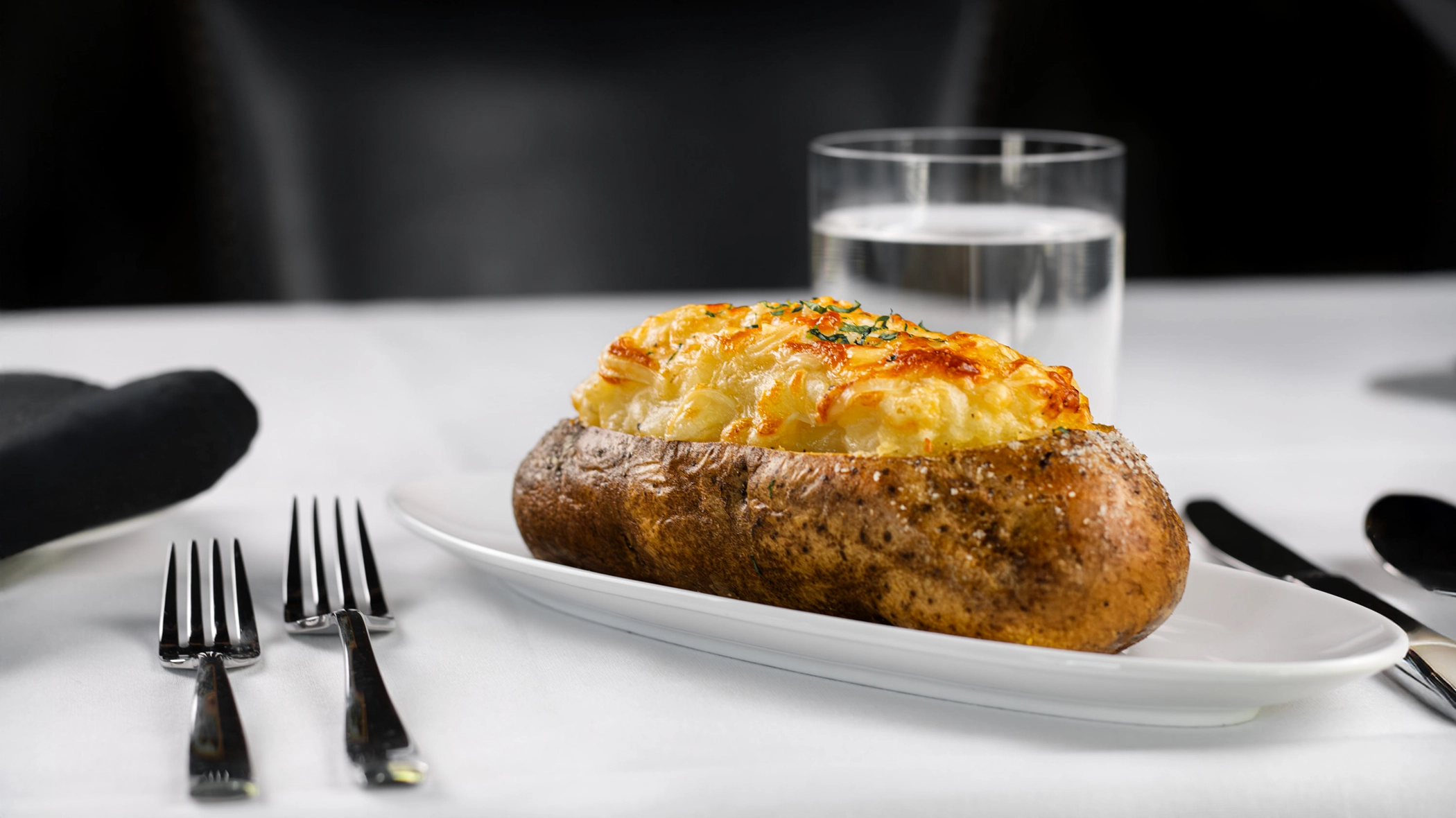 A steaming baked potato