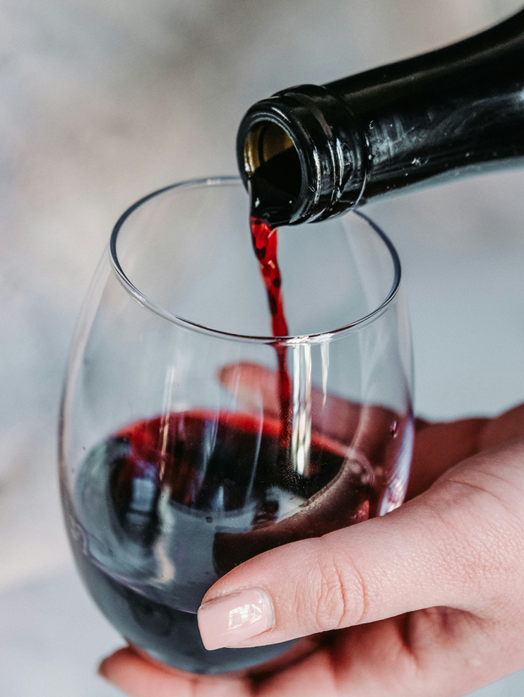 Wine being poured into a glass